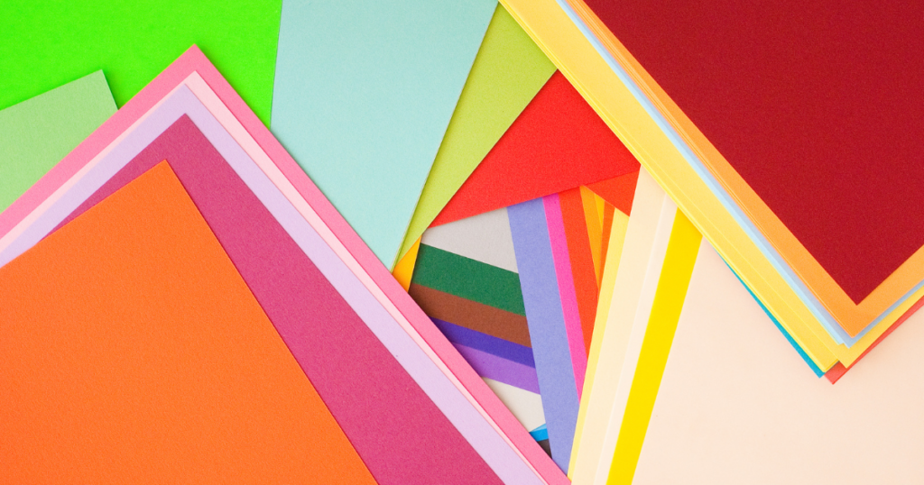 Stacks of colorful paper forming triangles